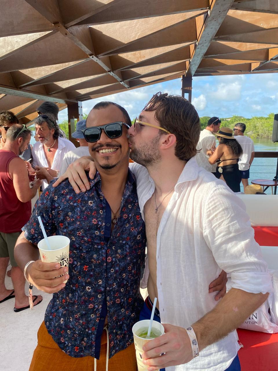 Two guests laughing together on the boat party