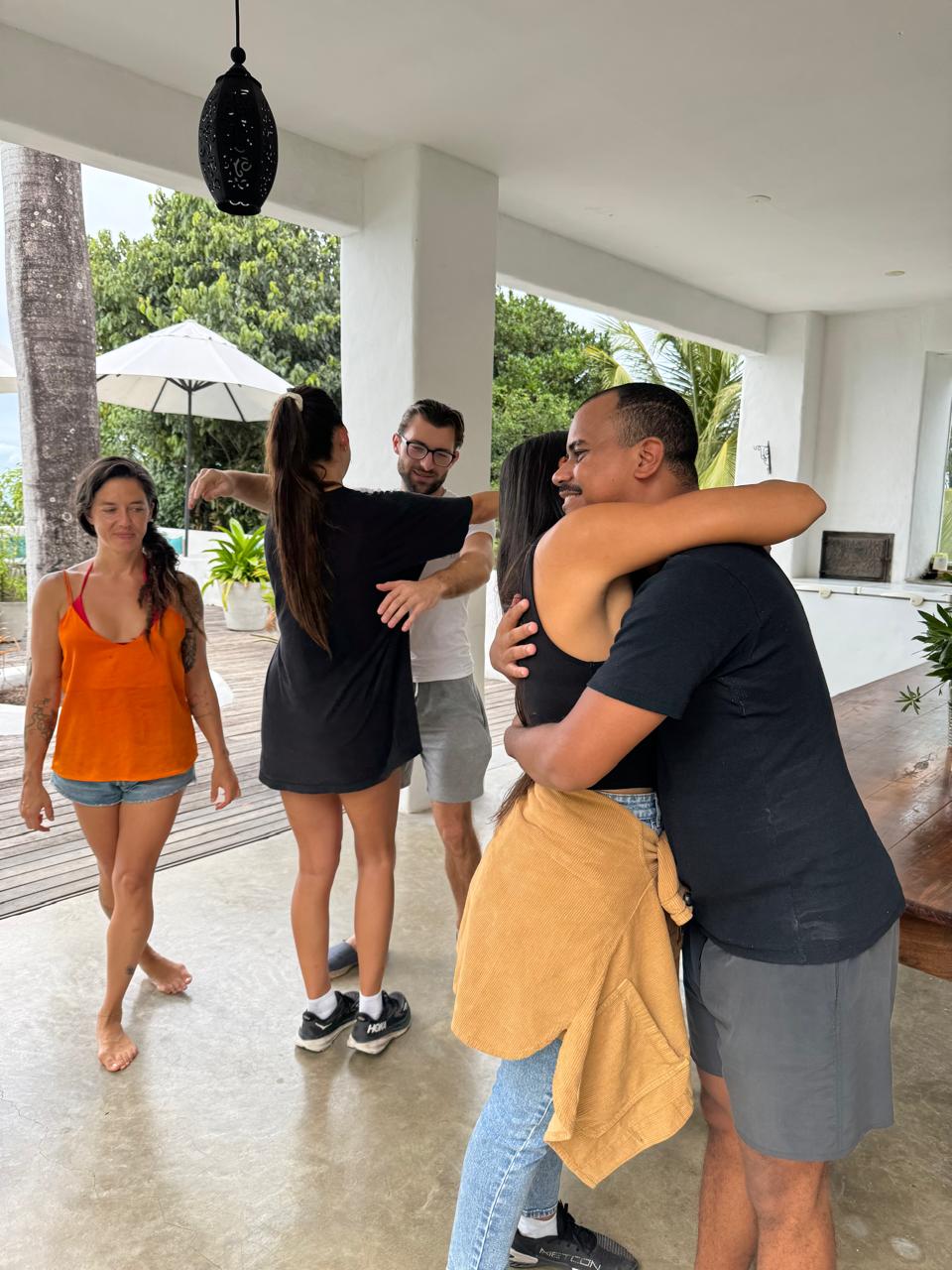 Guests hugging goodbye at the house in Búzios