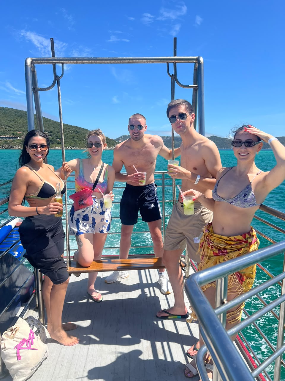 Vanessa and guests enjoying a boat party with caipirinhas